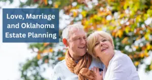 A happy senior couple embracing outdoors. The man has grey hair and is wearing a white shirt with an orange scarf. The woman has blonde hair and is wearing a white sweater. They are smiling and looking upwards with autumn foliage in the background. An overlay text reads "Love, Marriage and Oklahoma Estate Planning".